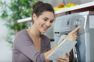 woman using new washing machine