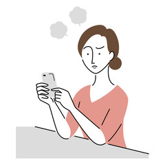 スマホを見て怒っている女性