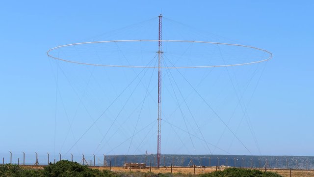 LORAN Long Range Navigation Antenna on Sunny Coastline Static.