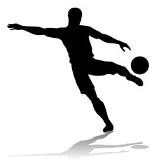 Fototapeta na wymiar A soccer or football player in silhouette