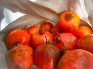 Pomegranate fruit from top angle showing its ends.