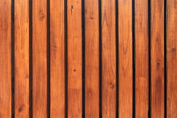 Old vintage red brown wood lath wall cladding for background and texture images.