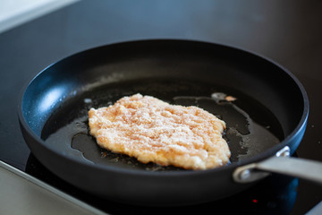 Pork chop in frying pan
