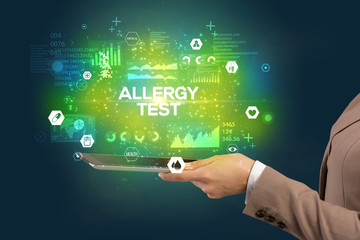 Fototapeta premium Close-up of a touchscreen with ALLERGY TEST inscription, medical concept