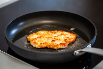 Pork chop in frying pan
