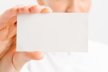  close-up portrait of a young businesswoman with Blank Business Card