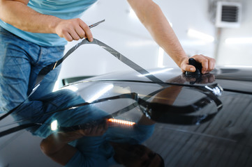 Male wrapper cuts car tinting, tuning service