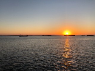 Fototapeta na wymiar beautiful panoramic view of the sun rising over the strait