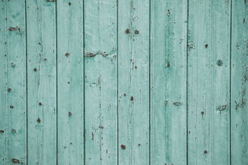 Fototapeta premium Vintage blue wood background texture with knots and nail holes. Old painted wood wall. Blue abstract background. Vintage wooden dark horizontal boards. Front view with copy space