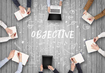 Group of business people working in office with OBJECTIVE inscription, coworking concept