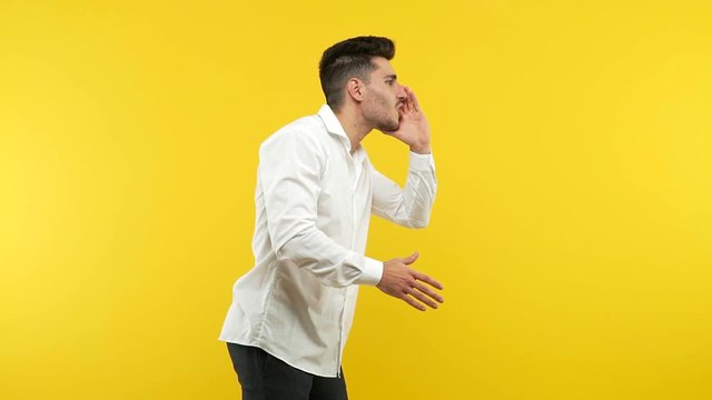 Young handsome man whispering gossip undertone, trying not to be heard