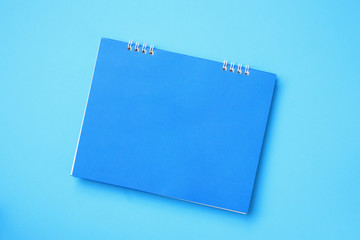 Empty blank calendar on blue background