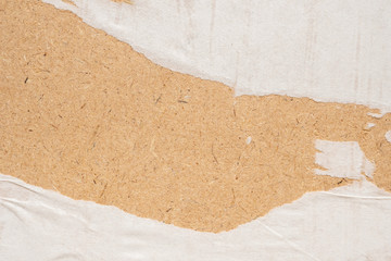 white torn crumpled and creased paper poster texture on brown wood board background