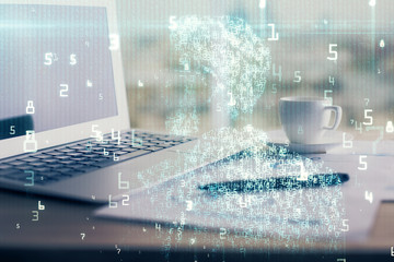 Double exposure of table with computer on background and data theme hologram. Data technology concept.