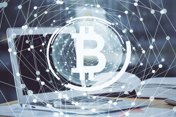 Double exposure of blockchain and crypto economy theme hologram and table with computer background....