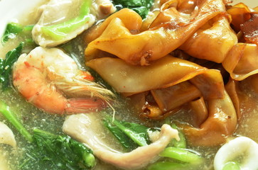 fried rice large noodles black soy sauce dressing mixed seafood and meat with Chinese kale in gravy...