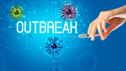 Syringe, medical injection in hand with OUTBREAK inscription, coronavirus vaccine concept