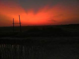 Obraz premium wind turbine at sunset