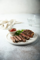 Grilled beef steak with tomato sauce