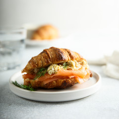 Croissant with smoked salmon and scrambled eggs