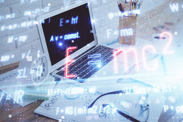 Desktop computer background and formula hologram writing. Double exposure. Education concept.