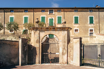 Fototapeta na wymiar Historical castle in Italy. Front view of medieval building (this entrance is located in Pozzolengo near Brescia