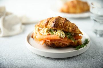 Croissant with smoked salmon and scrambled eggs