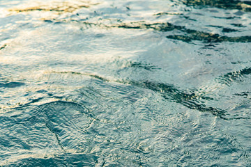 Swimming pool scene during golden hours.