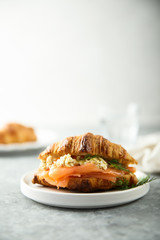 Croissant with smoked salmon and scrambled eggs
