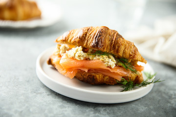 Croissant with smoked salmon and scrambled eggs