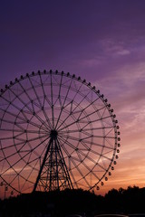 Ferris wheel after sunset at Kasai Rinkai koen, Tokyo, Japan. Purple and blue sky is beautiful.