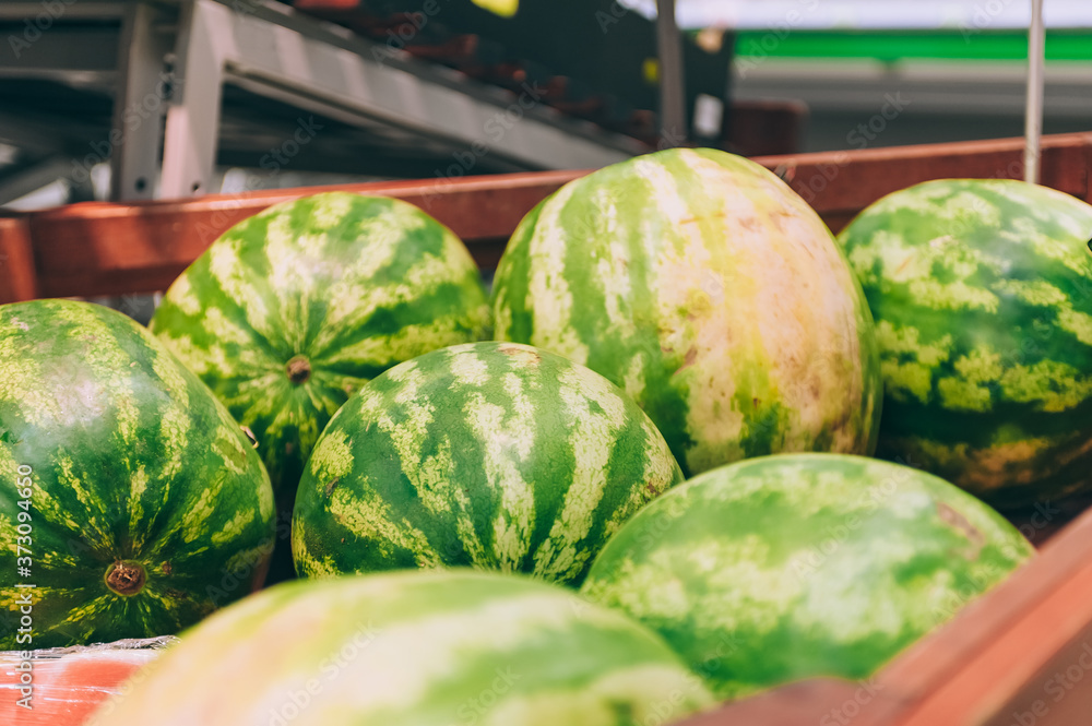 Wall mural A box of fresh watermelon in a supermarket.