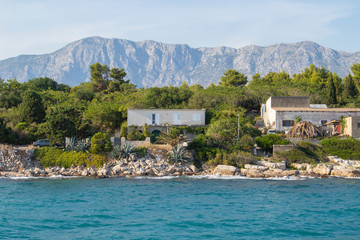 Old houses at the Hvar island in the town of Sucuraj, ferry boat port leading to the croatian...