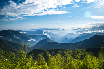 Fototapeta premium The panoramic layers of the Himalayan mountains of Sikkim, India are covered with clouds and fog.