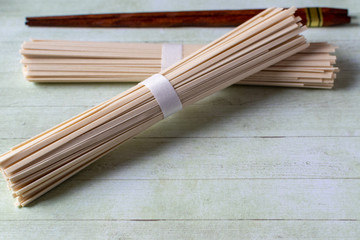 wooden chopsticks and Japanese udon noodles 