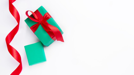  Christmas green gifts with red ribbon on a white background.free space for your text