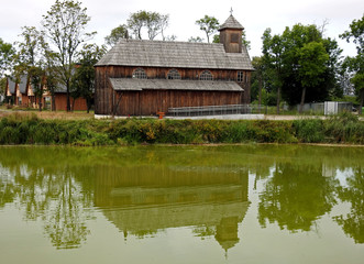 Fototapeta premium built in 1932, a wooden Roman Catholic branch church dedicated to God's Mercy at the palace and park complex in the city of Łochów in Masovia, Poland