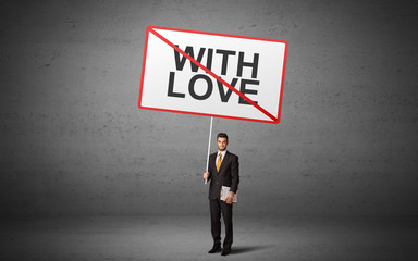 Fototapeta premium business person holding a traffic sign with WITH LOVE inscription, new idea concept