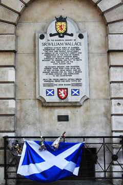London, UK, April 30, 2011 : Memorial plaque to Sir William Wallace (Braveheart) outside St Bartholomew's Hospital in Smithfields with the Scottish Scotland flag stock photo image