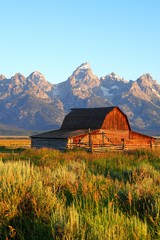 Sunrise over Mormon Row in Grand Teton National Park with the mountains in the background in...