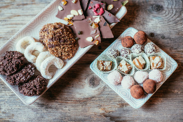 Traditional homemade Christmas cookies: Variety of sweet European cookies on rustic wooden desk, powdered sugar.