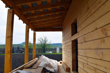 country house Construction. Unfinished wooden house. Life in the country.