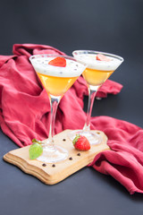Italian dessert panna cotta with strawberries and lemon