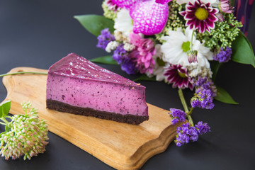 Homemade cheesecake with fresh blueberries and mint for dessert - healthy organic summer dessert pie cheesecake. Creative atmospheric decoration.