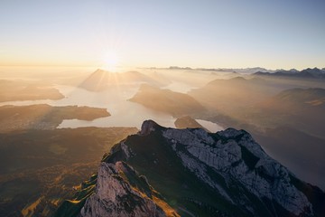 Scenic view of lake and mountains at sunrise