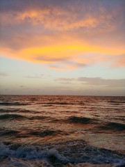 Mango Color Clouds in Sky at Ocean