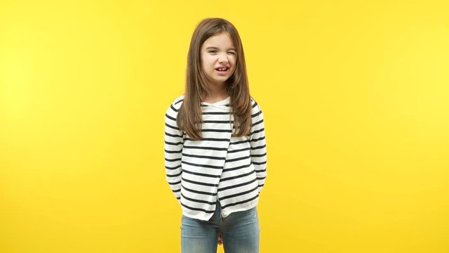 Funny little child girl winking