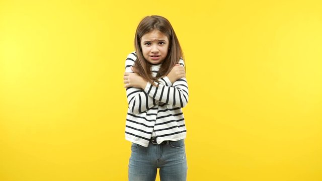Funny little child girl going cold
