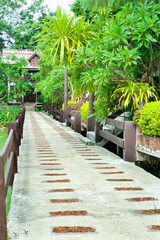 Stone walkway in the park with green grass
