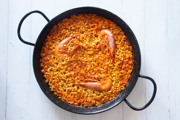 Traditional spanish paella with red prawns.